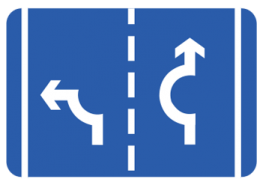 Signs showing exit directions at a roundabout